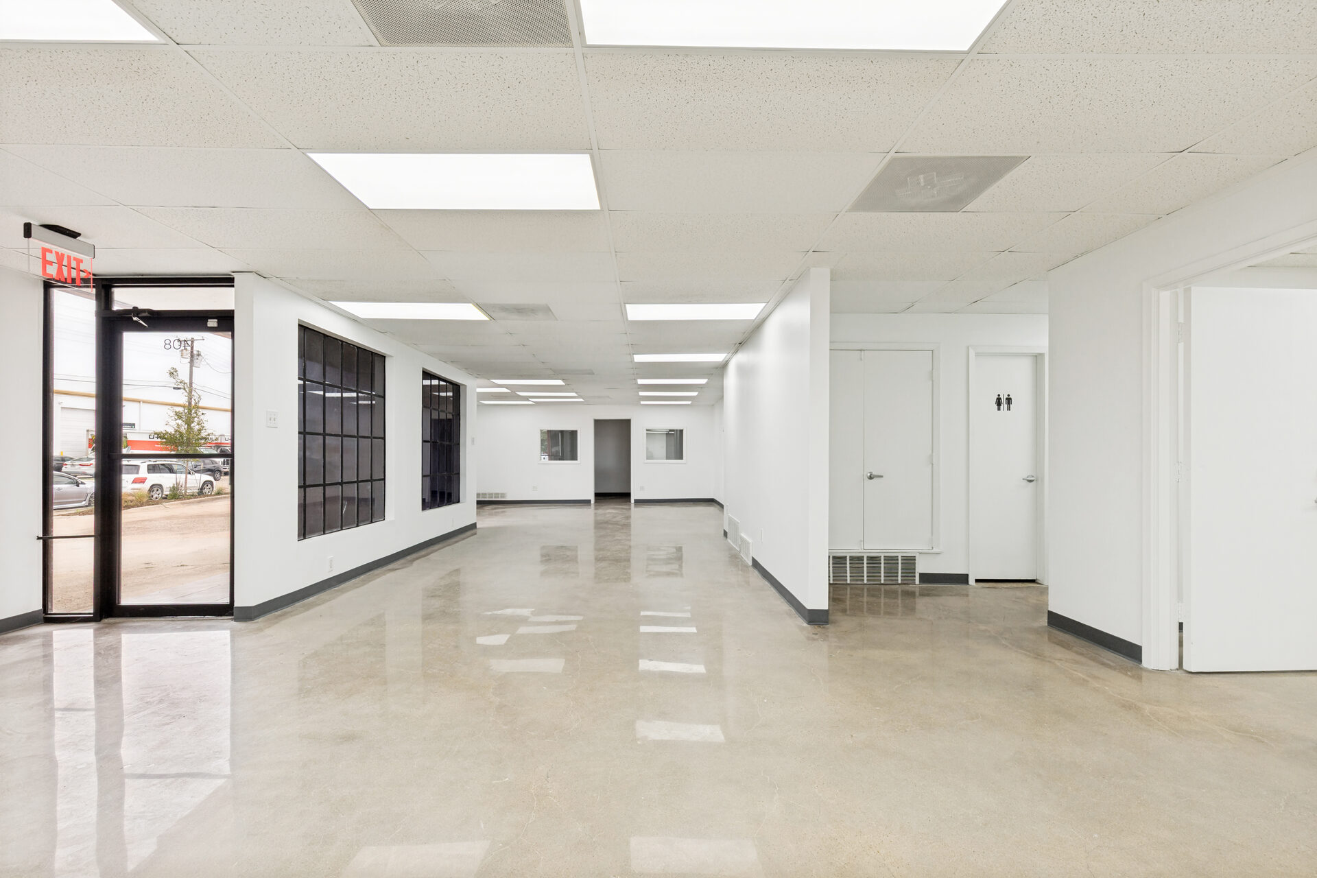 400 Bishop Ave renovation — renovated office space with polished concrete floors and new storefront windows, Richardson TX