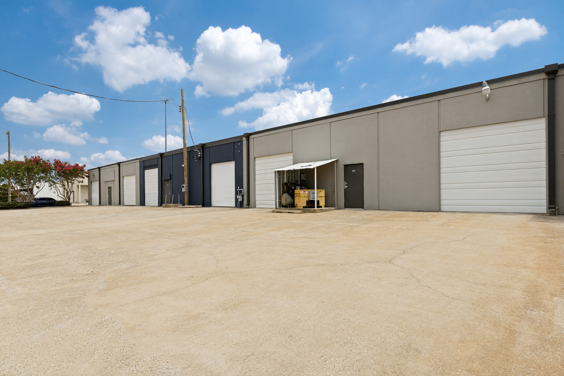 400 Bishop Ave renovation — repainted building exteriors with new overhead doors, Richardson TX