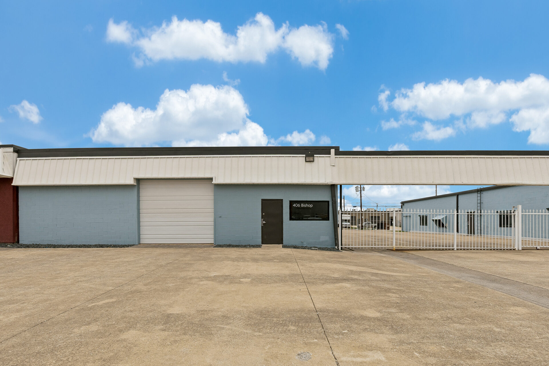 400 Bishop Ave renovation — renovated building exterior with new paint and storefront entry, Richardson TX