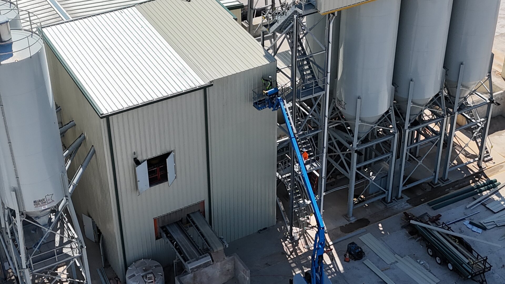 Oldcastle plant expansion — close aerial view of the structure beside the concrete silos