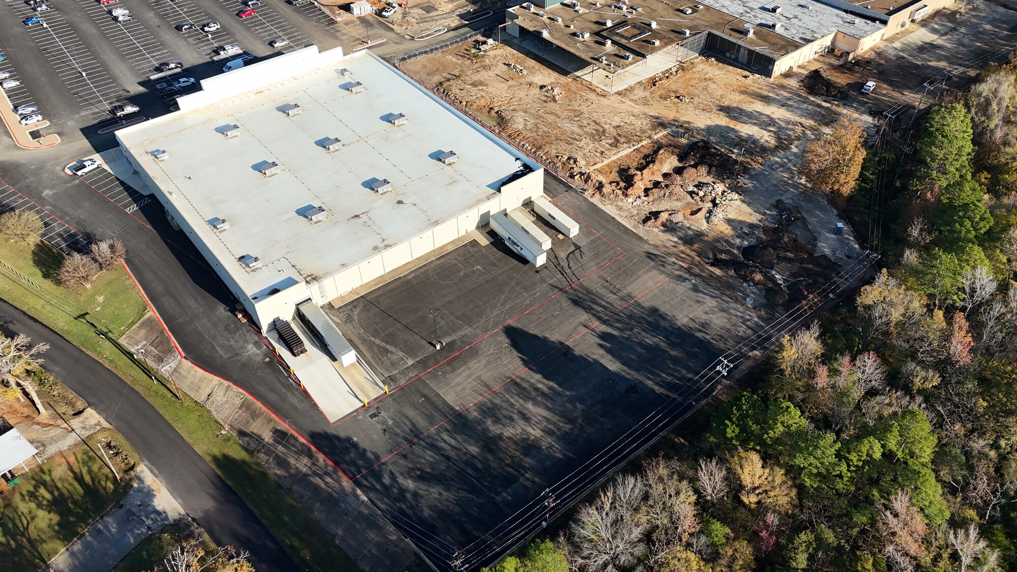 Palestine Mall Academy Sports redevelopment — asphalt and utility site work, Palestine TX